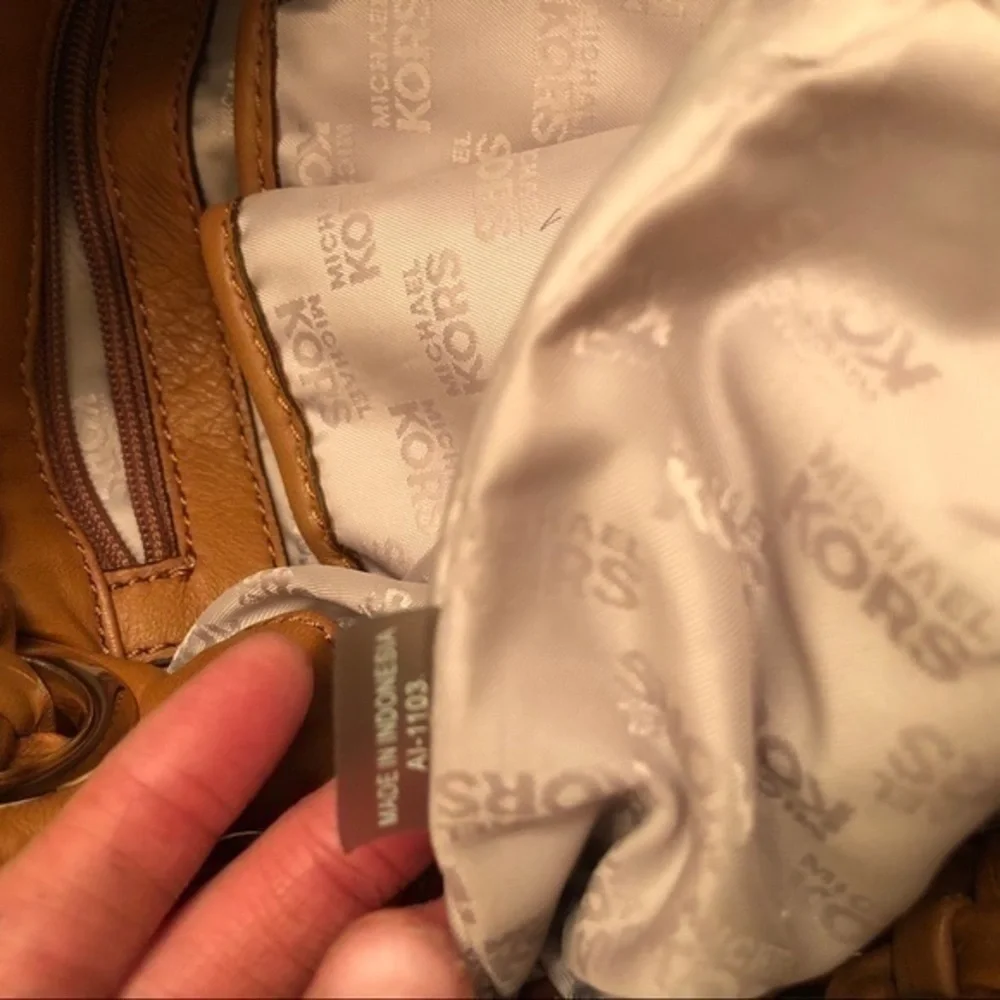 Michael kors brown leather grommet tassel bag